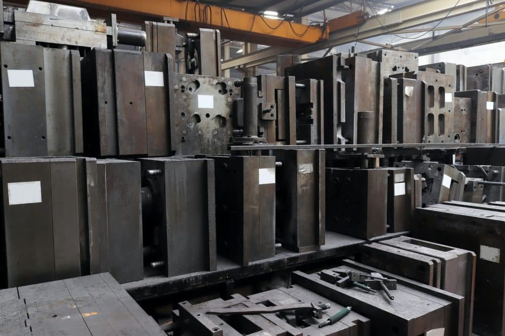 Metal molds in warehouse building of large production factory